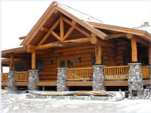 Staining and natural wood finishes on a custom log home